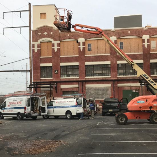Work Van from A. Pennachi & Sons, Co. onsite at a buildin restoration project in New Jersey.